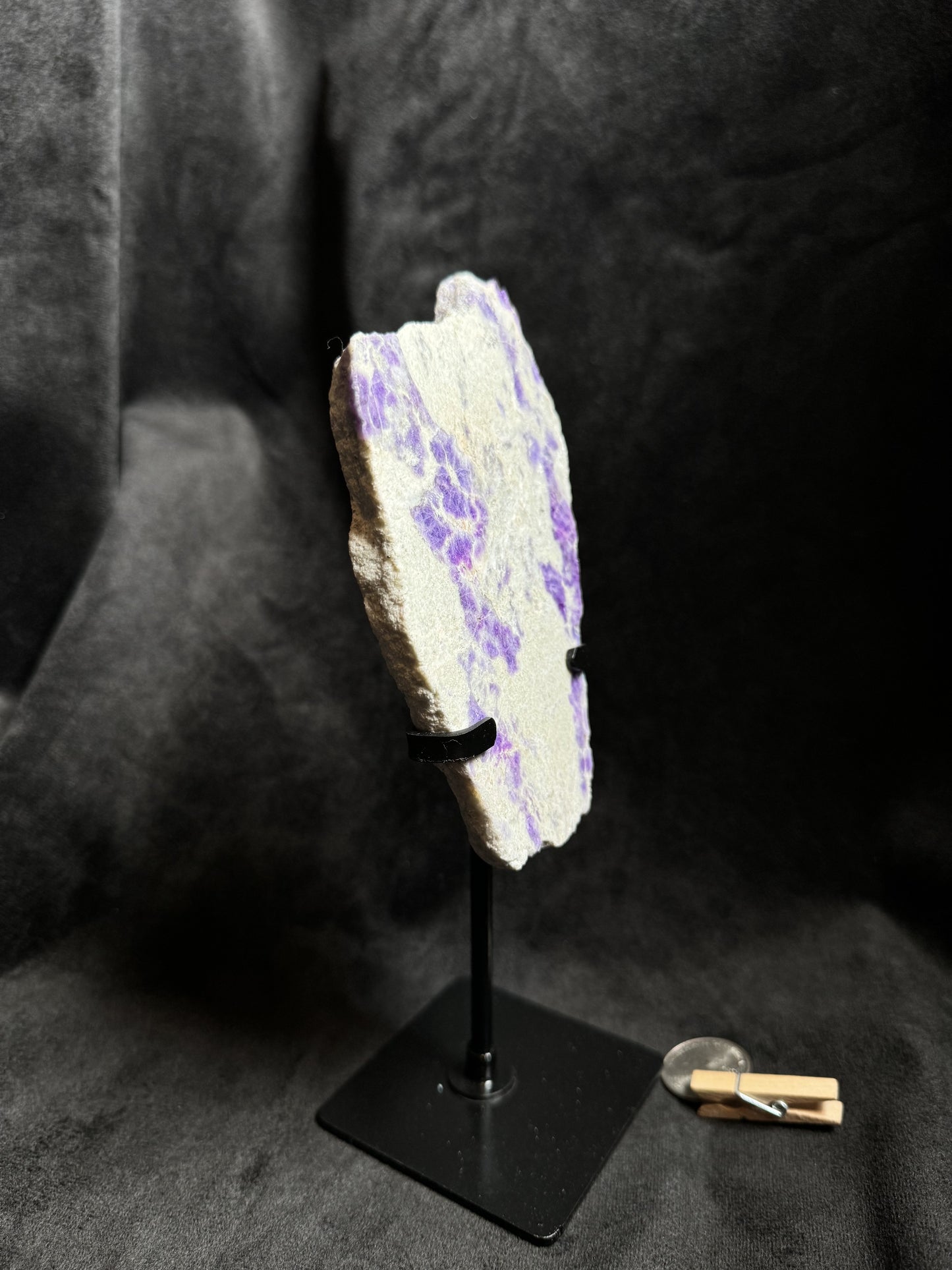 Hackmanite Slab on a metal stand