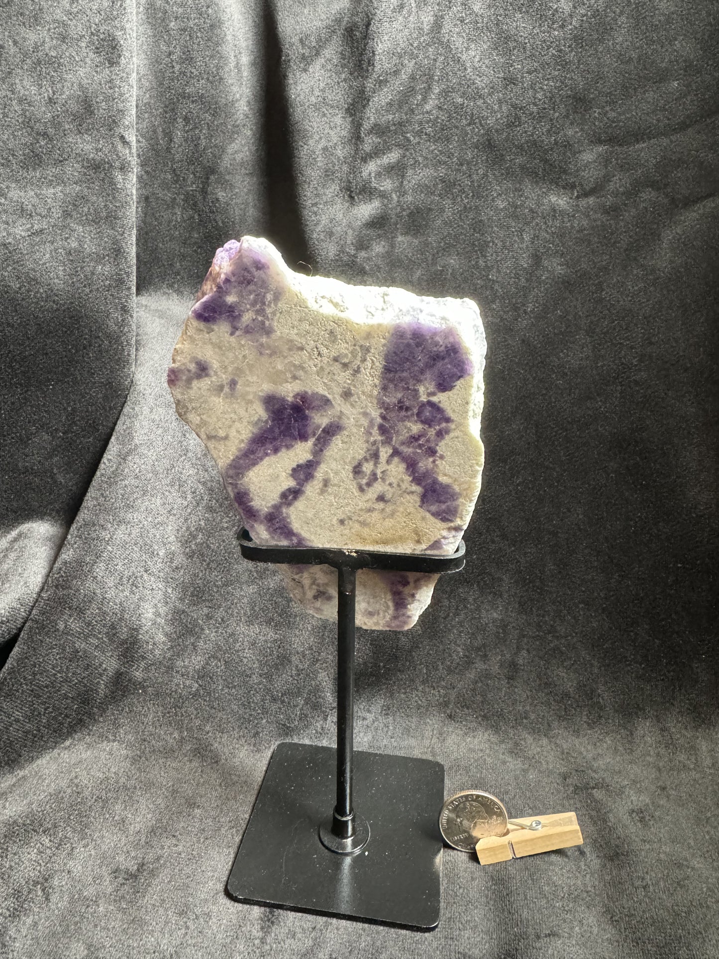 Hackmanite Slab on a metal stand