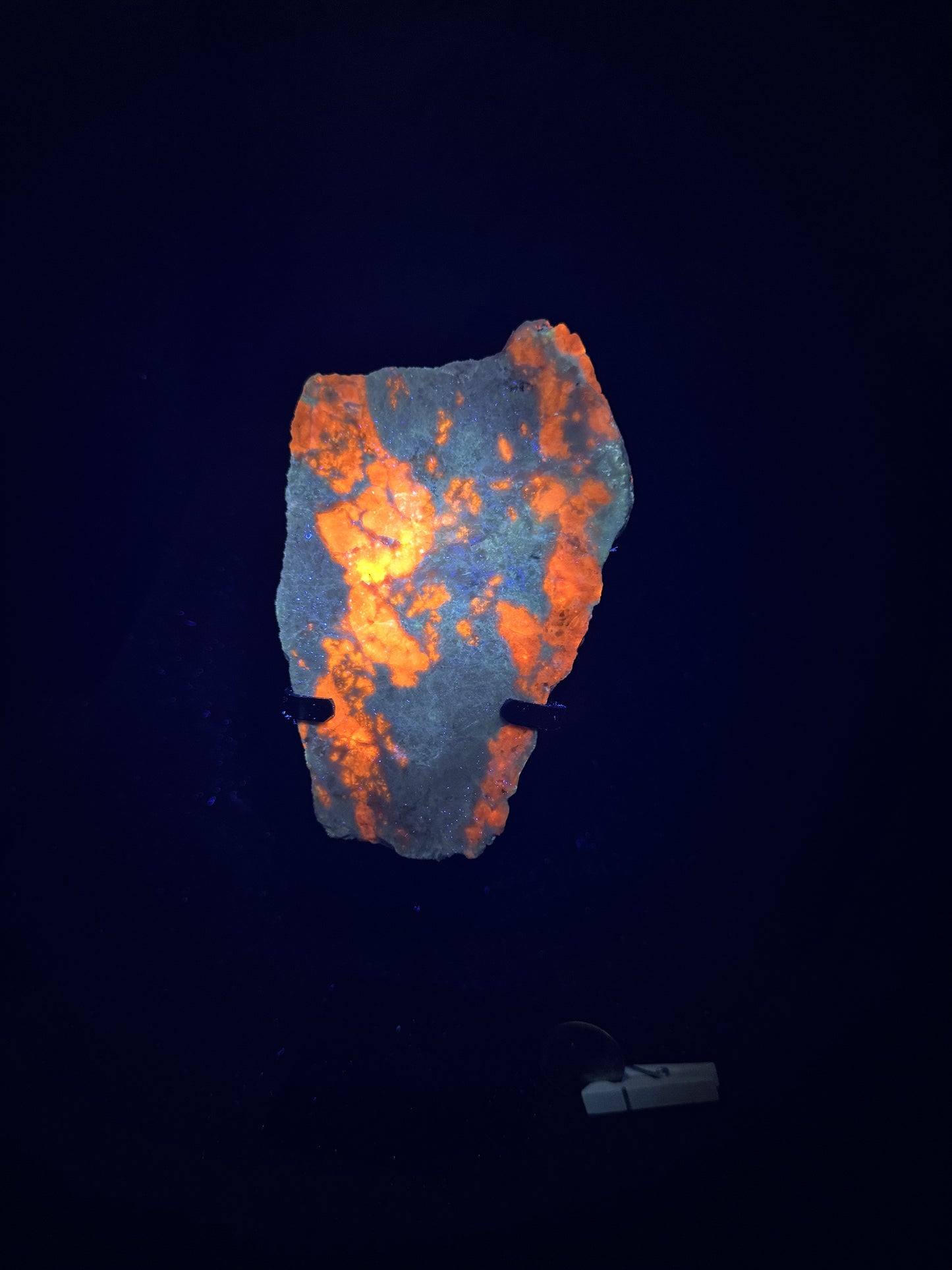 Hackmanite Slab on a metal stand