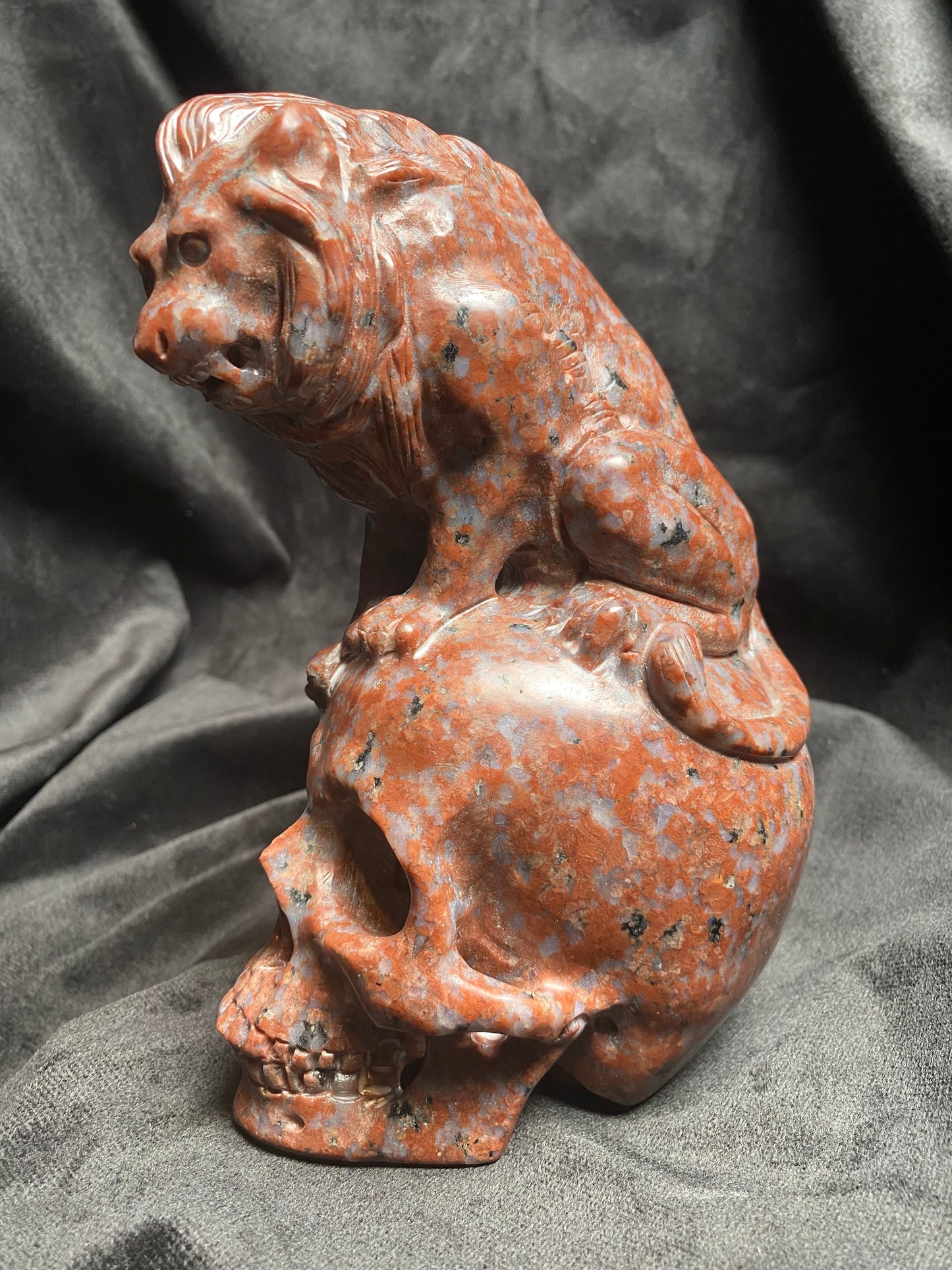 Large Imperial Red Granite Lion on top of a Skull