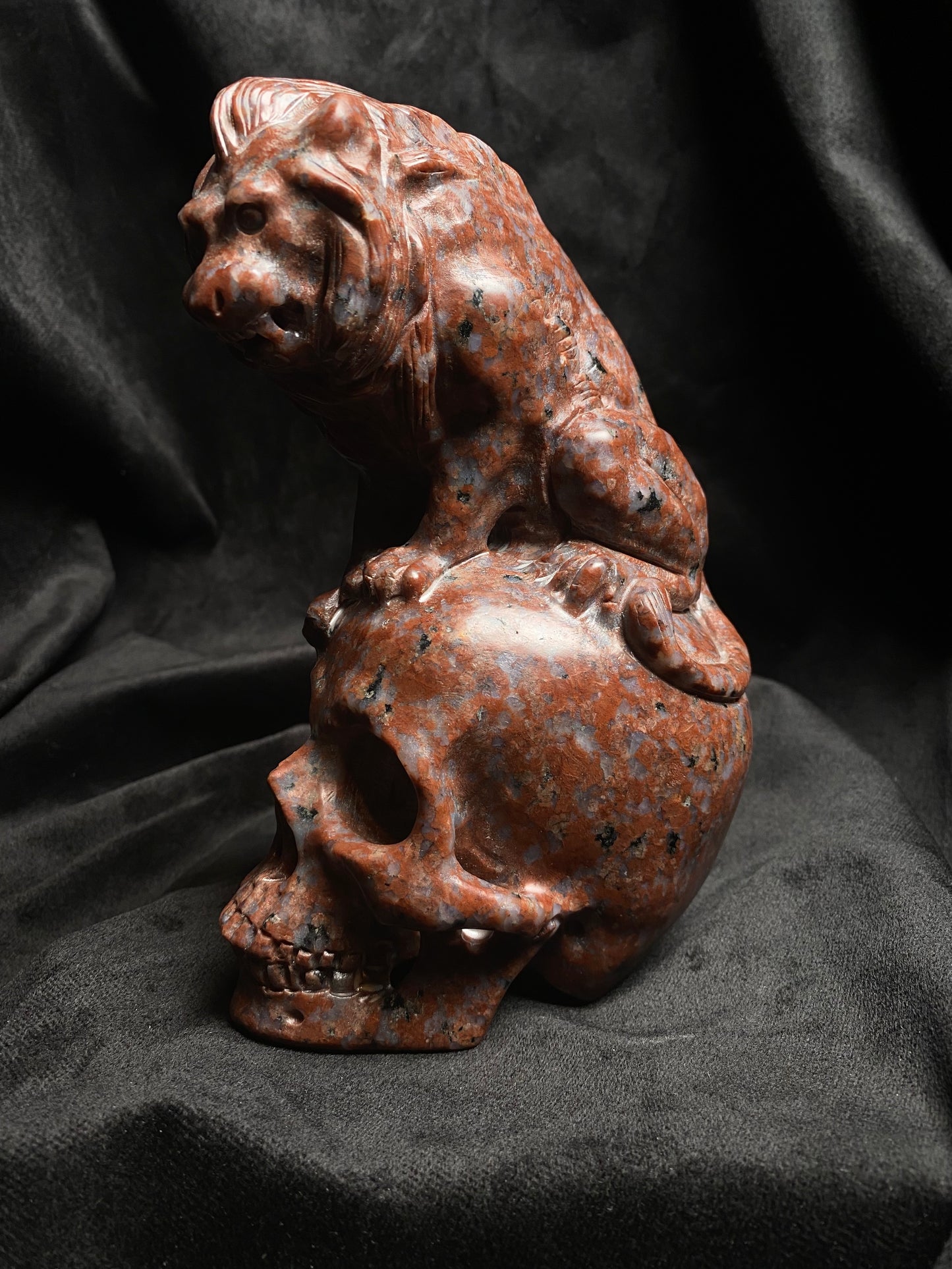 Large Imperial Red Granite Lion on top of a Skull