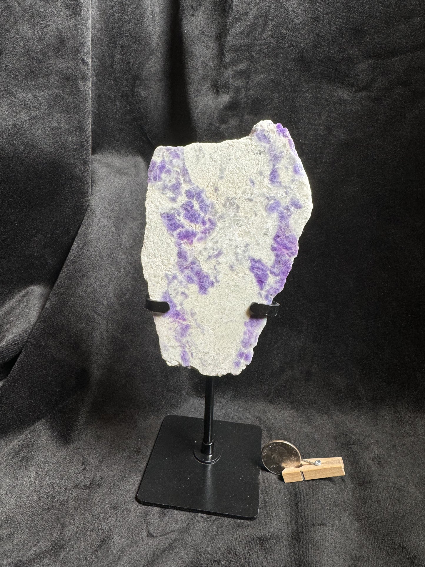 Hackmanite Slab on a metal stand