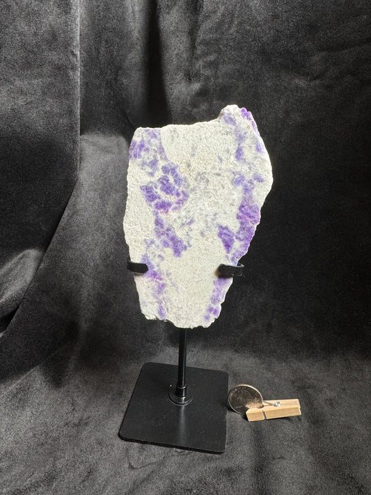 Hackmanite Slab on a metal stand