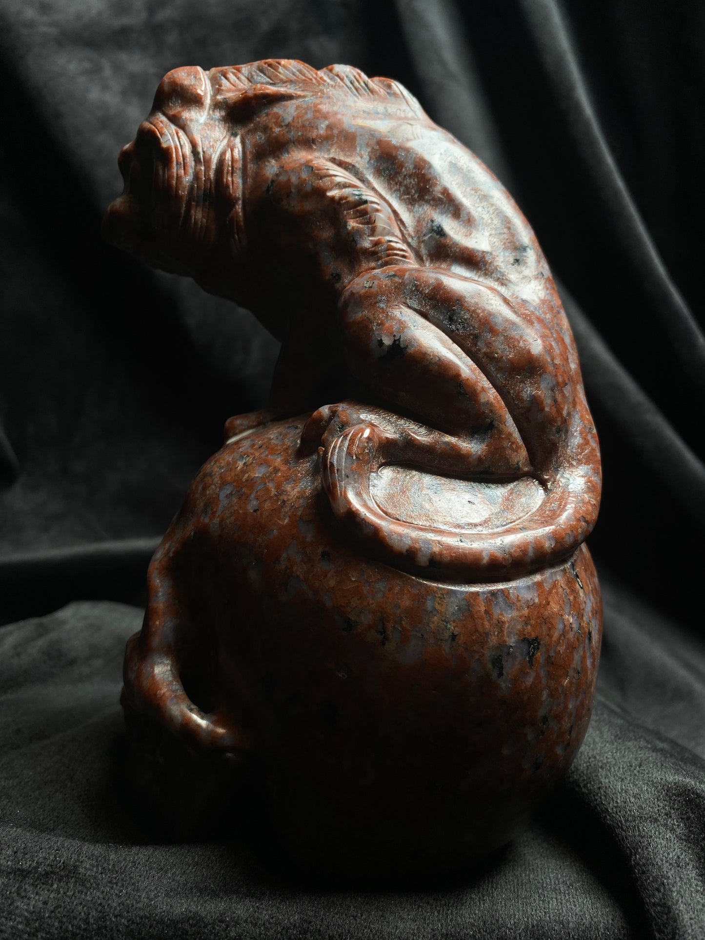 Large Imperial Red Granite Lion on top of a Skull