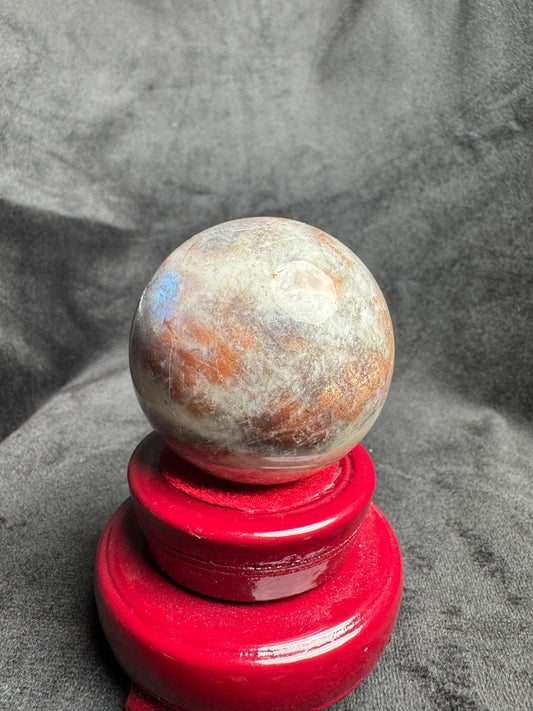 Moonstone Sphere with blue silver and gold flash